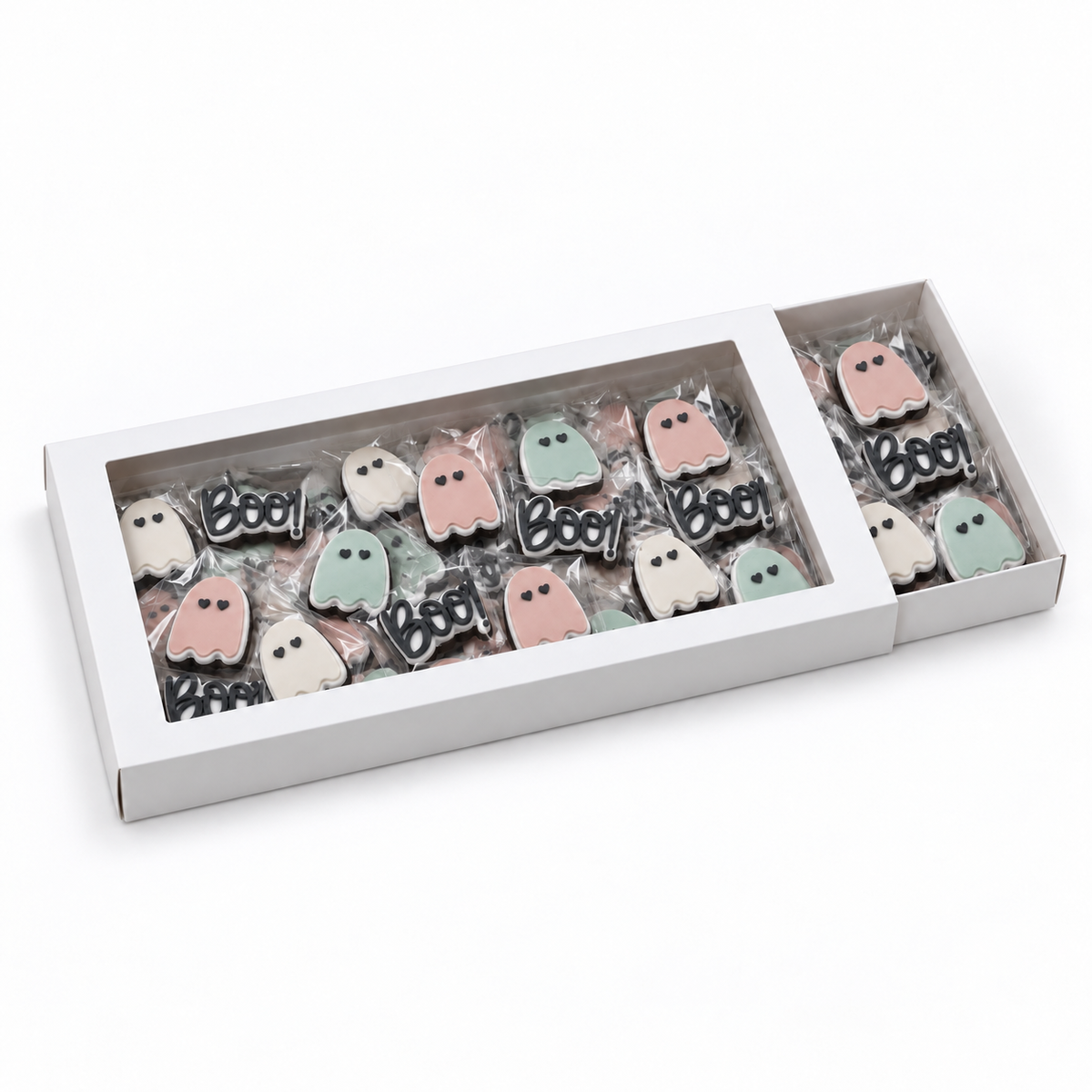 White windowed gift box filled with individually wrapped mini ghost and BOO! Halloween fondant sugar cookies.