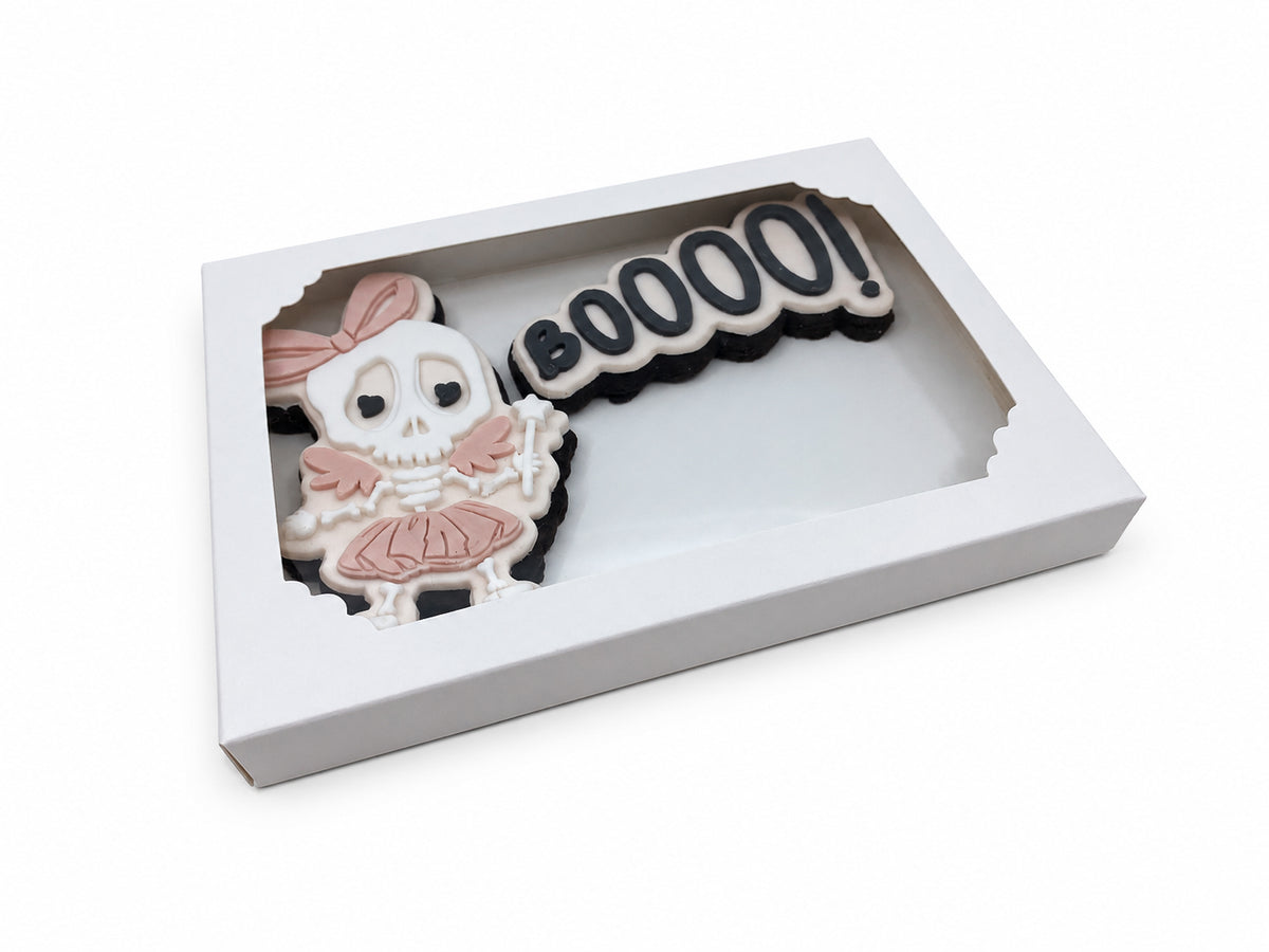 Skeleton ballerina and BOOOO fondant sugar cookies presented in a white windowed gift box.